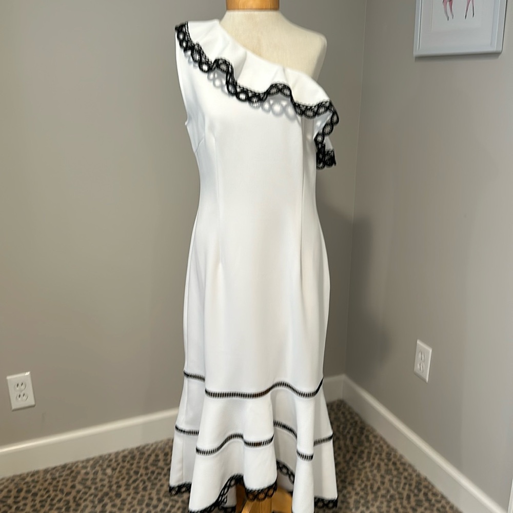 Why white with black trim one shoulder maxi dress. Asymmetrical bottom